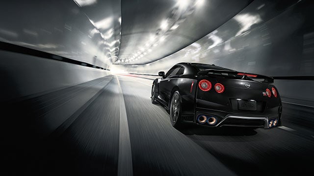 2023 Nissan GT-R seen from behind driving through a tunnel | Romeo Nissan in Kingston NY