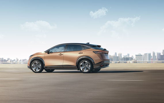 Nissan ARIYA side view on broad highway | Romeo Nissan in Kingston NY